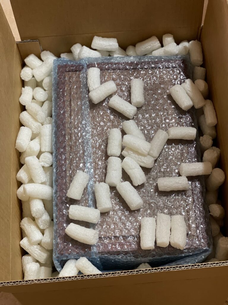 Secure packaging for a Monolith series Jarrah urn - Protective shipping for modern handmade timber memorials from Western Australia.